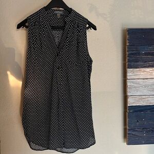 Black tank with white polka dots.